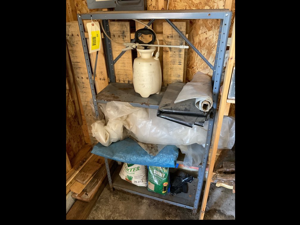 Metal shelf with miscellaneous fertilizer, plastic