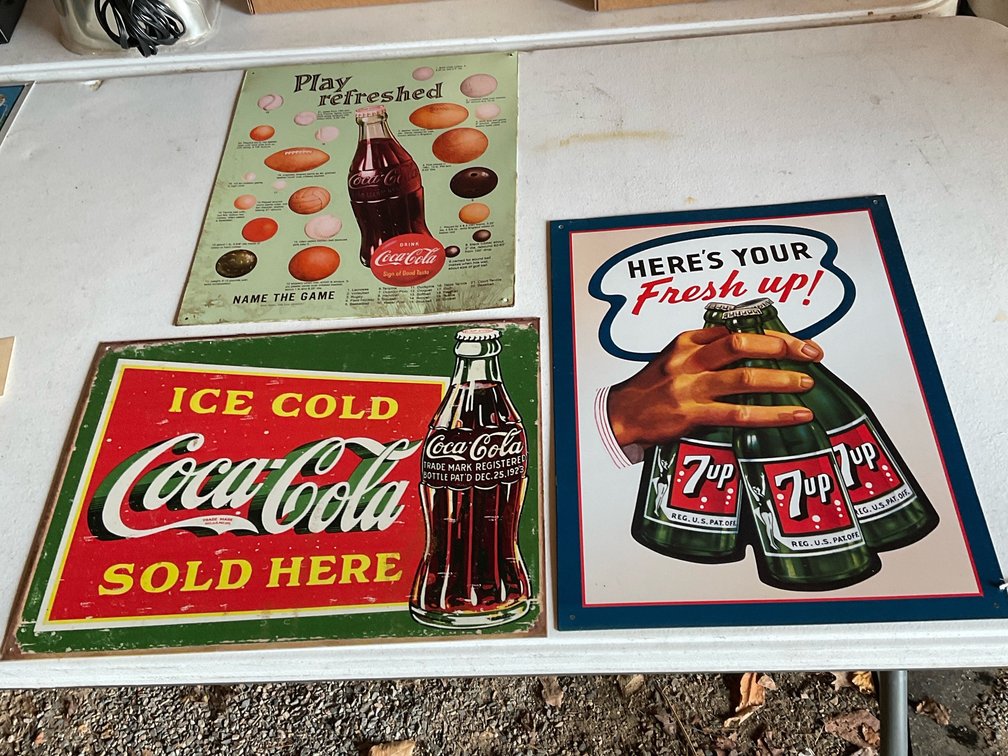 Coca-Cola and 7-Up metal signs