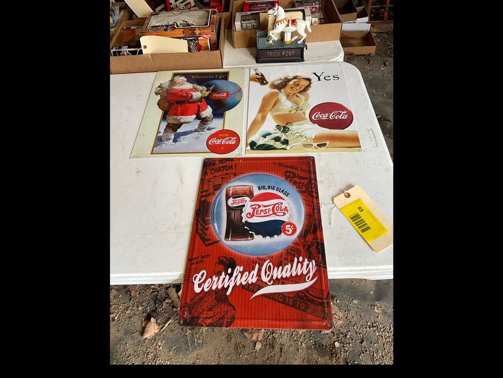 Coca-Cola and Pepsi metal signs