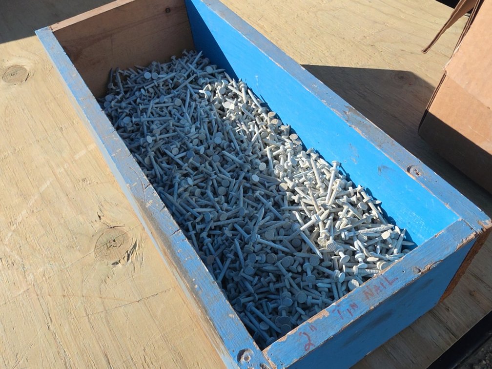 WOODEN BOX OF 2" TIN NAILS