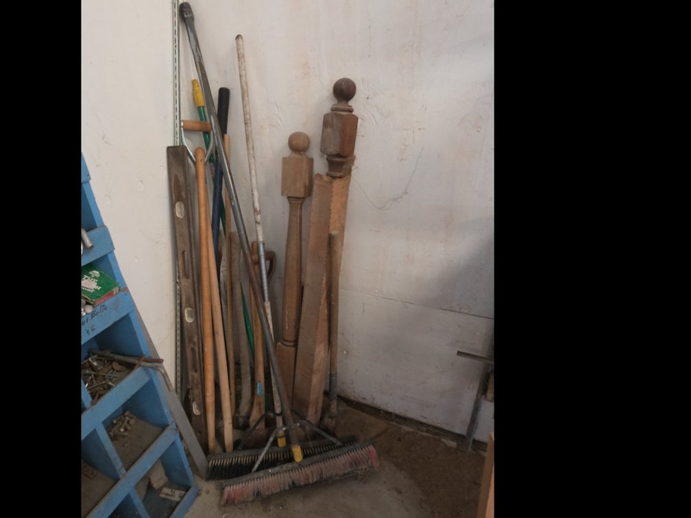 ASSORTED BROOMS, AXES, ETC IN CORNER