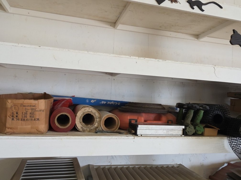 SHELF OF ASSORTED ITEMS - SAW BLADES, PLASTIC MESH, TOOLS, ETC