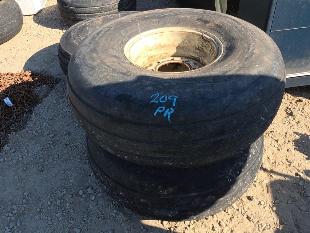 (2) 16.5L-16.1SL TIRES ON 8 BOLT RIMS