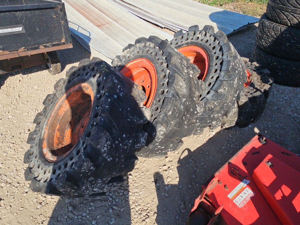 (4) 12-16.5 HEAVY DUTY SKIDLOADER TIRES ON RIMS