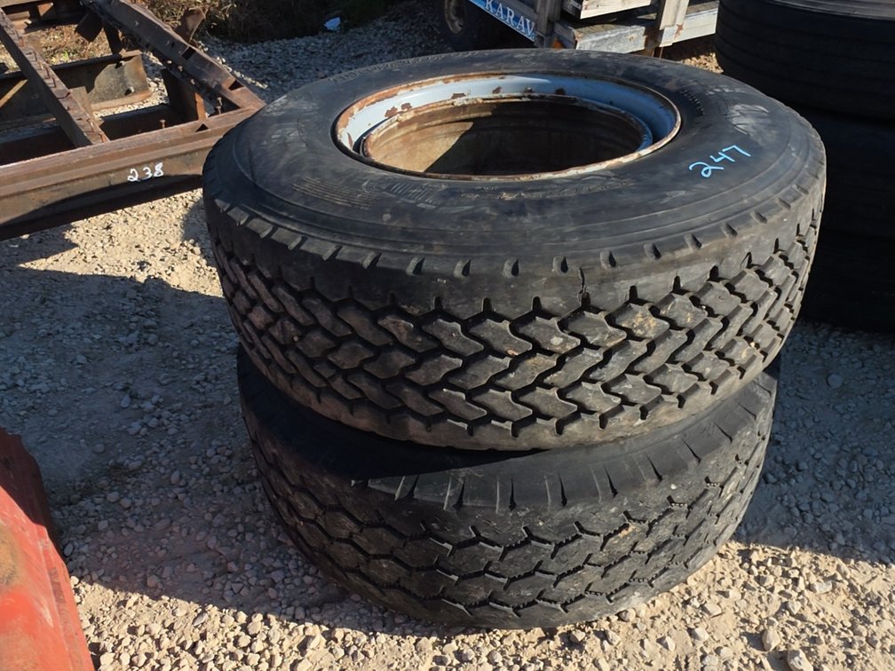 PAIR OF 385/65R22.5 TIRES ON FLOATER RIMS- DIFFERENT TREAD