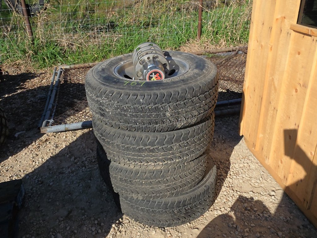 (4) 235/75R15 TIRES ON 6 BOLT ALUMINUM RIMS- PLEASE INSPECT