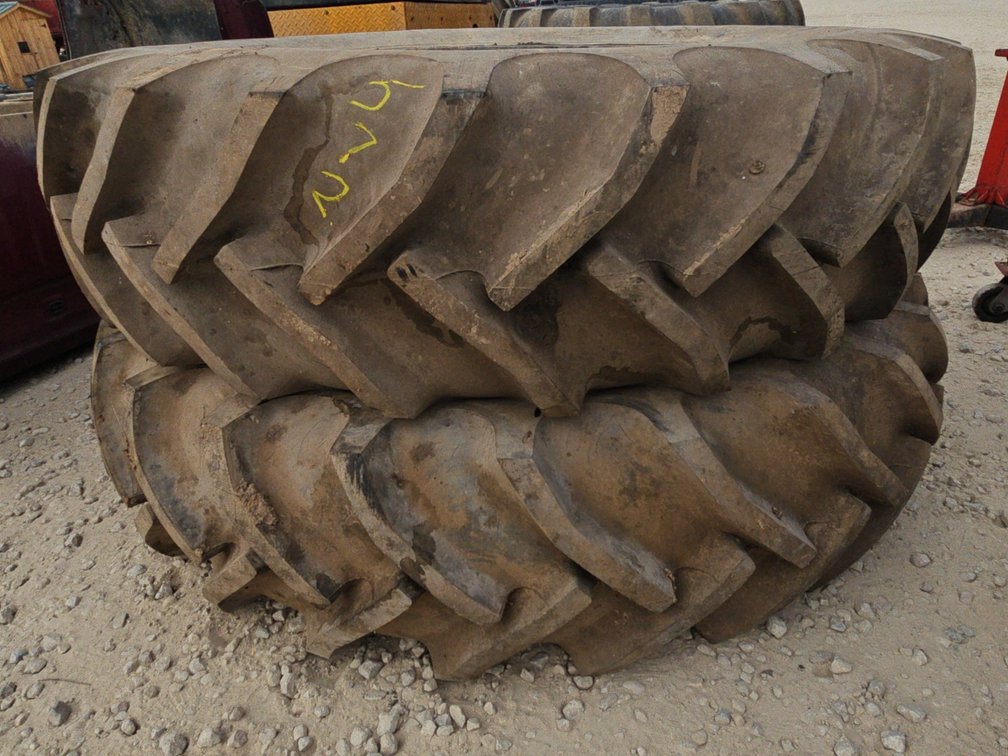 PAIR 15.5-38 TIRES - VERY WEATHERED AROUND BEADS