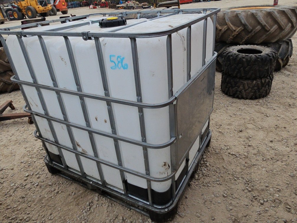 250 GALLON POLY TOTE IN CAGE