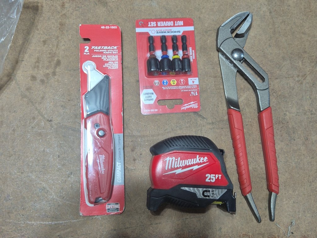 NEW MILWAUKEE FAST BACK, TAPE MESURE, NUT DRIVER SET, ETC.