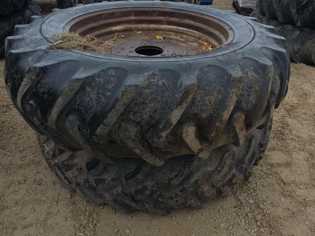 PAIR 18.4-38 TIRES ON 9 BOLT RIMS