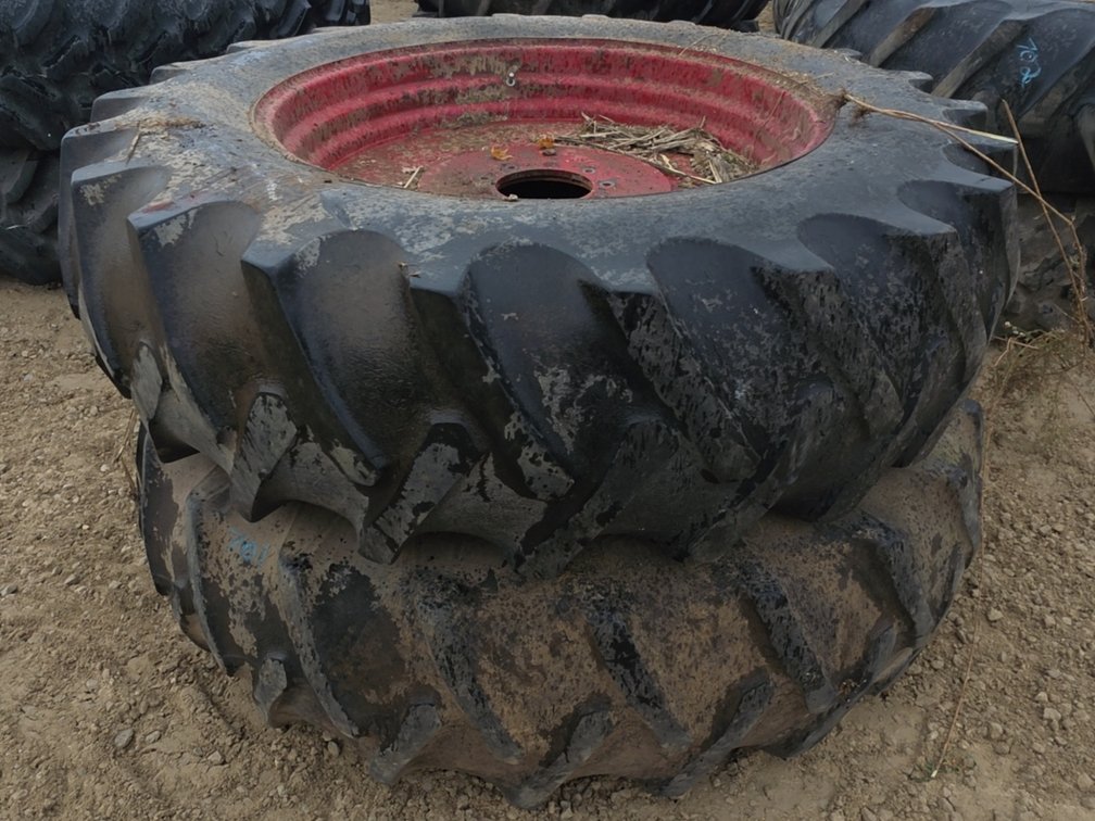 PAIR 18.4-38 TIRES ON 9 BOLT RIMS