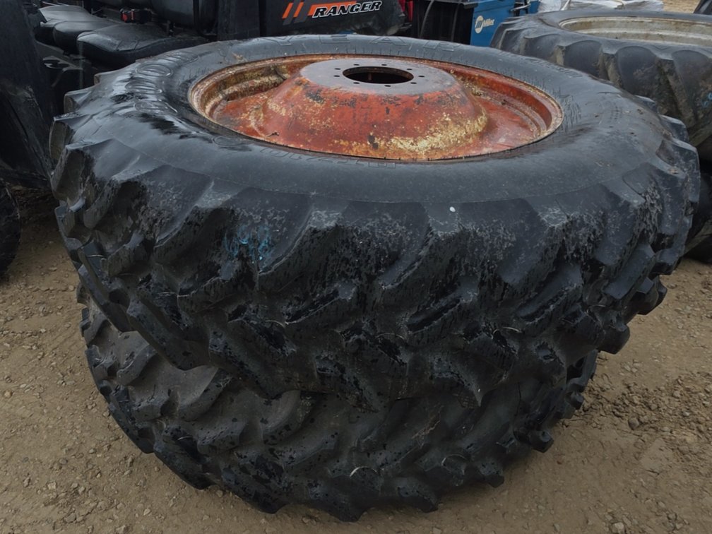 PAIR 18.4-38 TIRES ON 9 BOLT RIMS