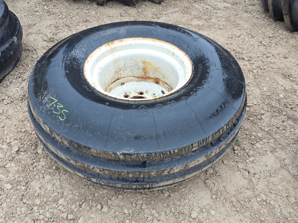 (1) 11.00-16 TIRE ON 8 BOLT RIM