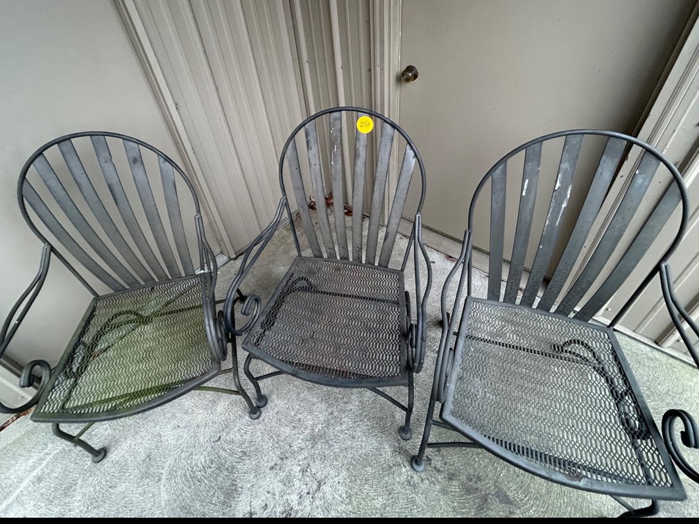 Three metal lawn chairs