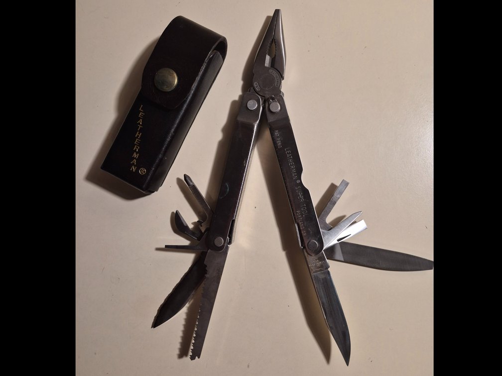 Vtg. Leatherman Super Tool with Leather Sheath