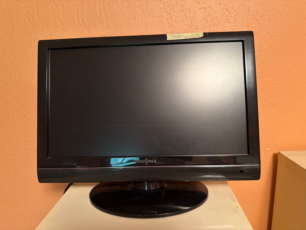 Insignia Television with Oval Stand