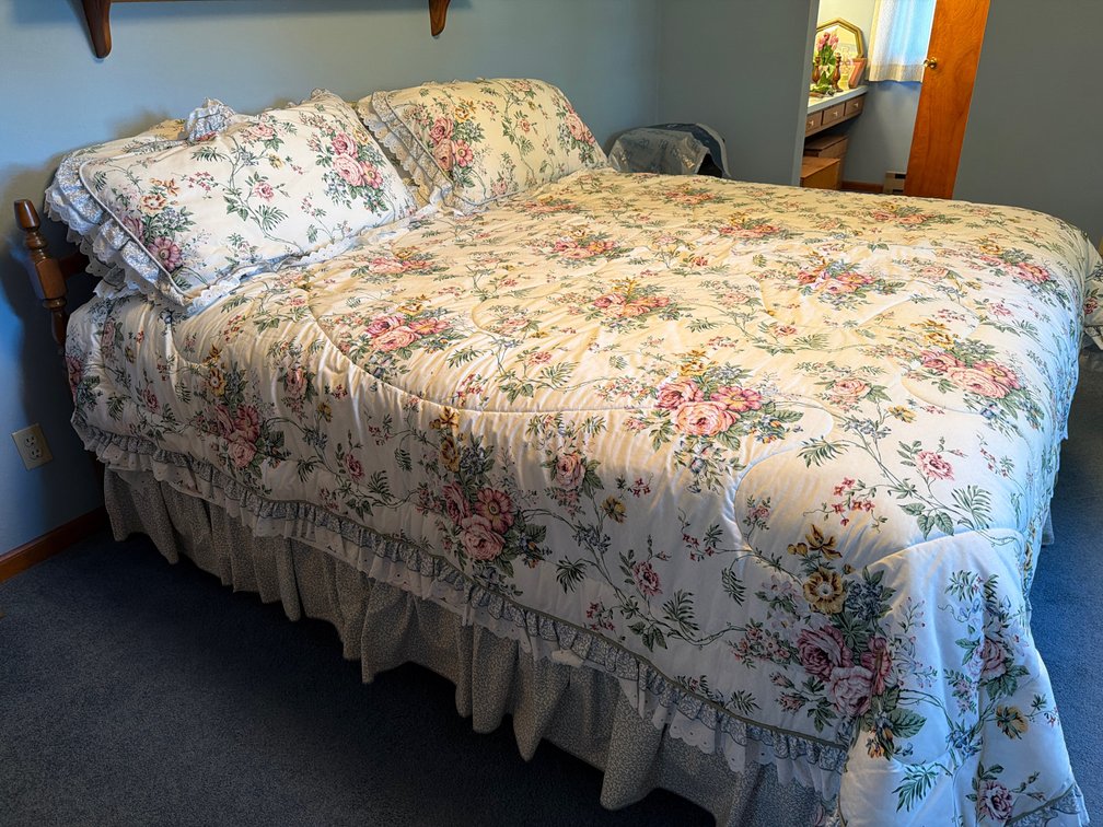 Stained Wood Bed with Floral Bedding Ensemble