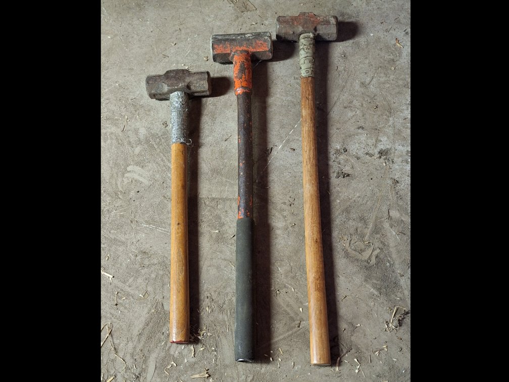 Three Sledgehammers with Wood and Metal Handles