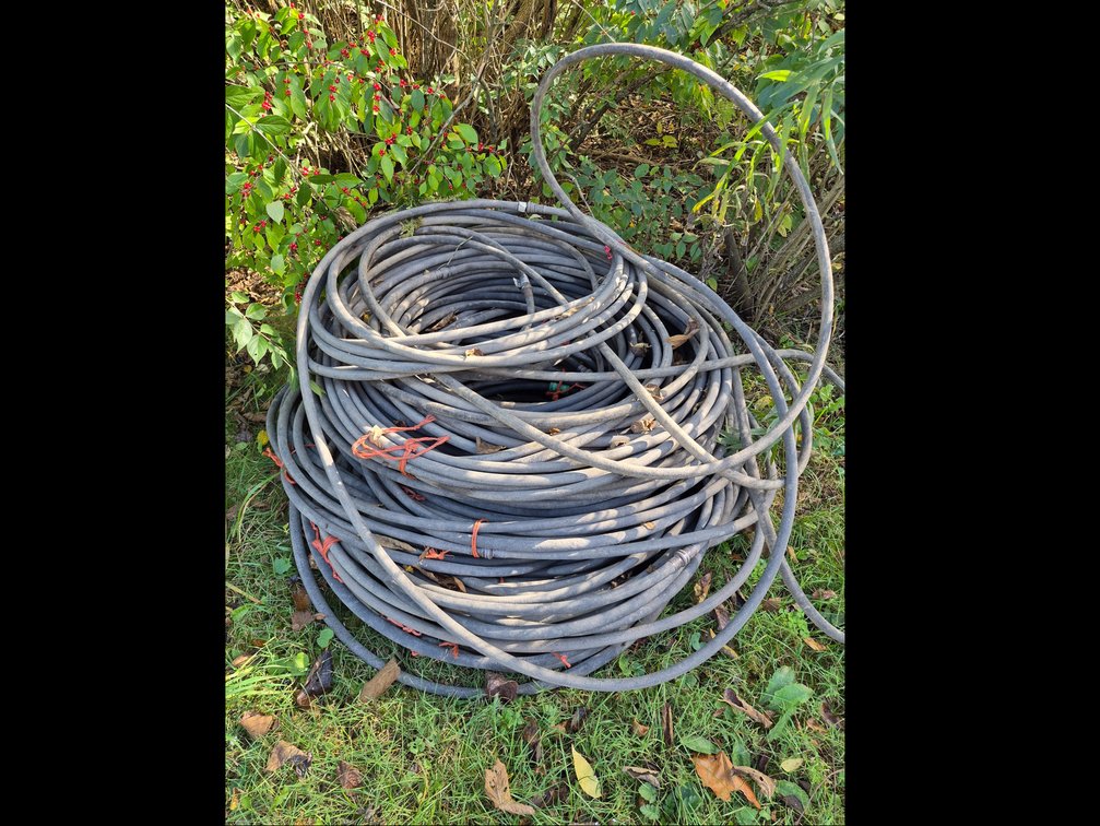 Coiled Black Flexible Soaker Hose with Metal End Couplings