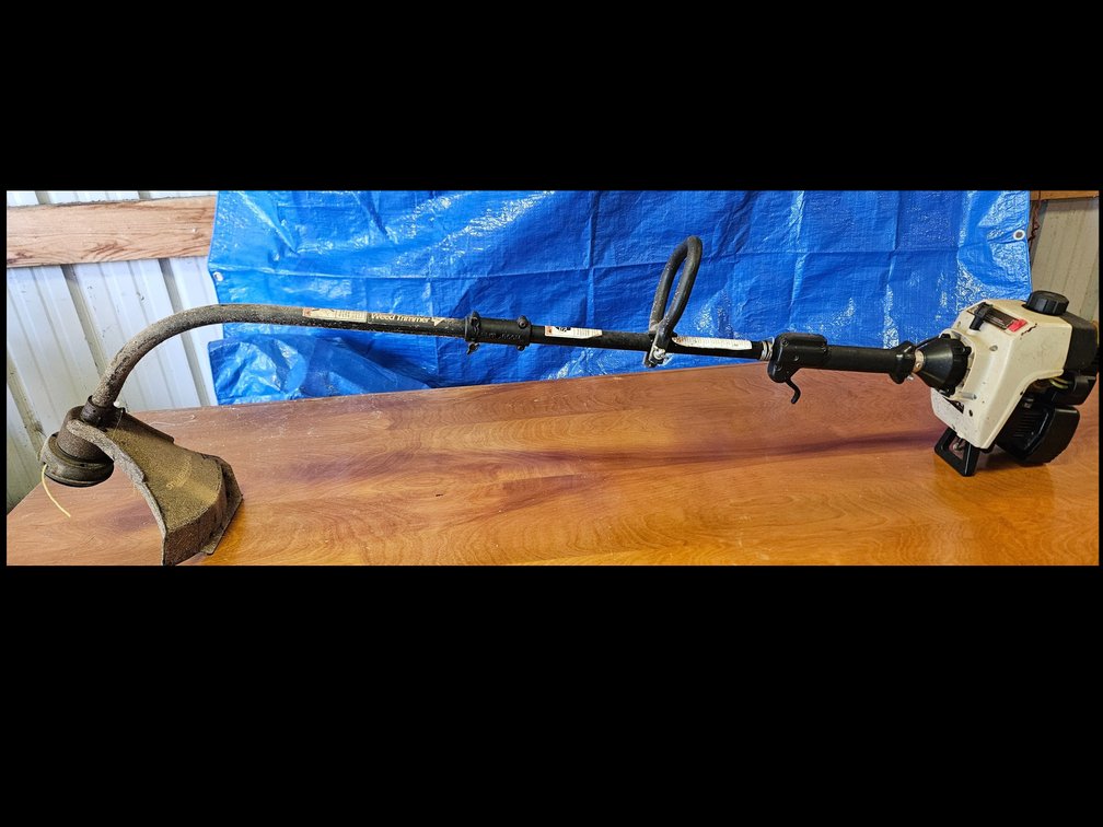 idc Inertia Dynamics Corp. Curved-Shaft String Trimmer