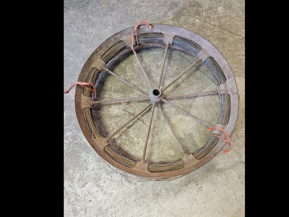 Metal Spoked wheel Using as a Wire Dispenser Reel with Wire Coil