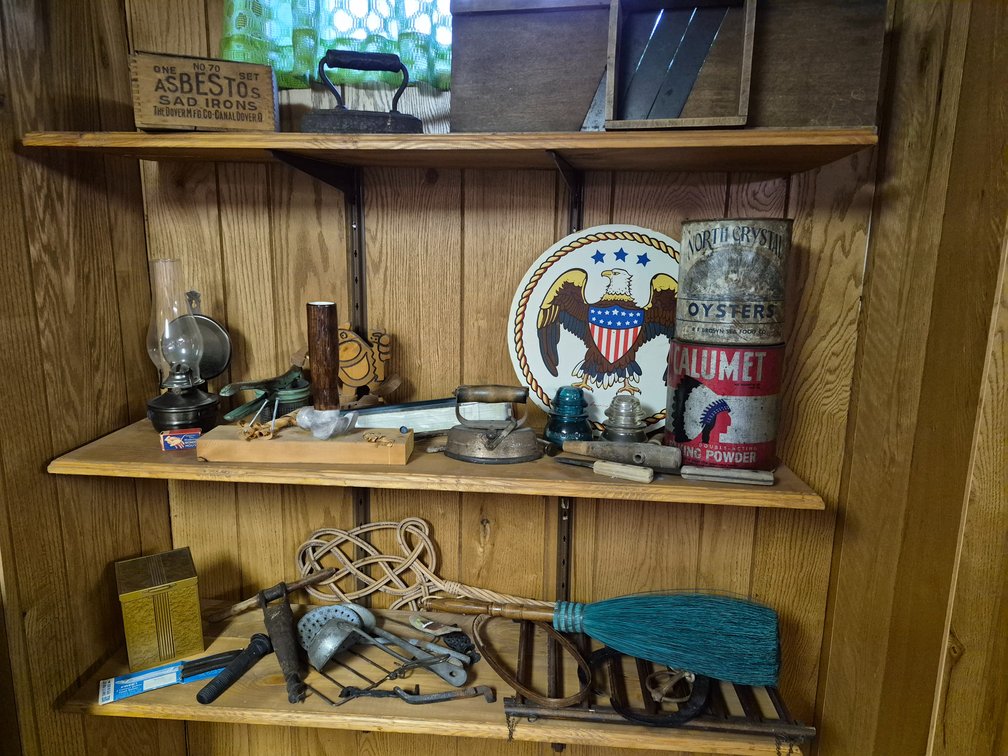 Sad Irons, Advertising Tins, Kraut Cutter, and Hand Tools