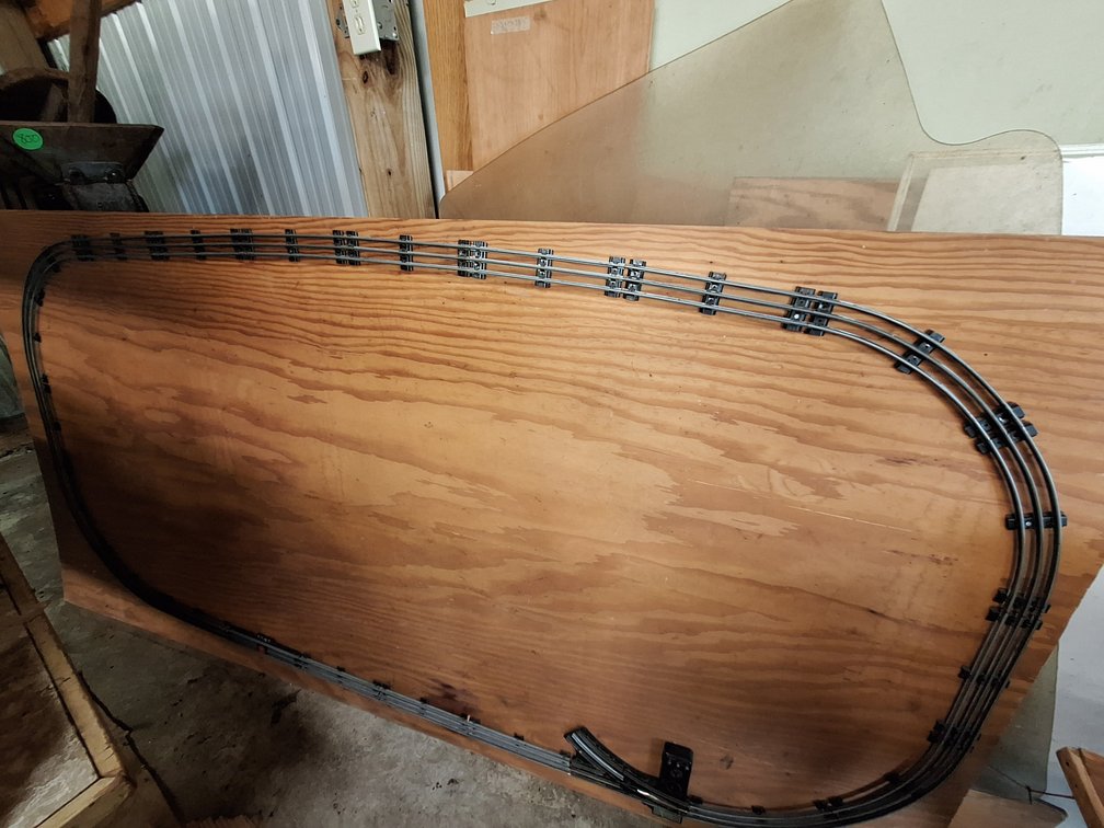 Model Train Track Layout on Plywood Board