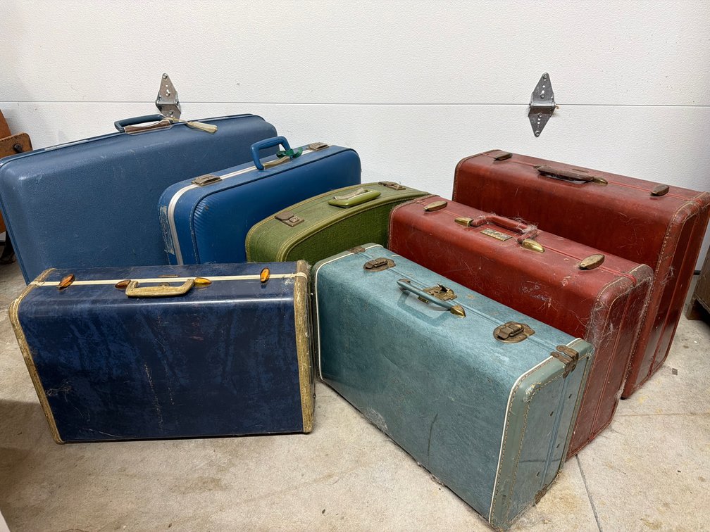 Hard-Sided Suitcases with Metal Latches and Handles