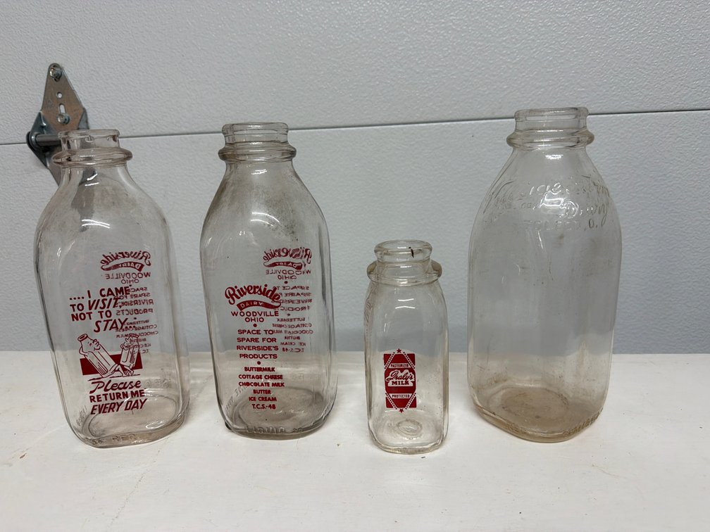 Clear Glass Pyroglazed and Embossed Milk Bottles