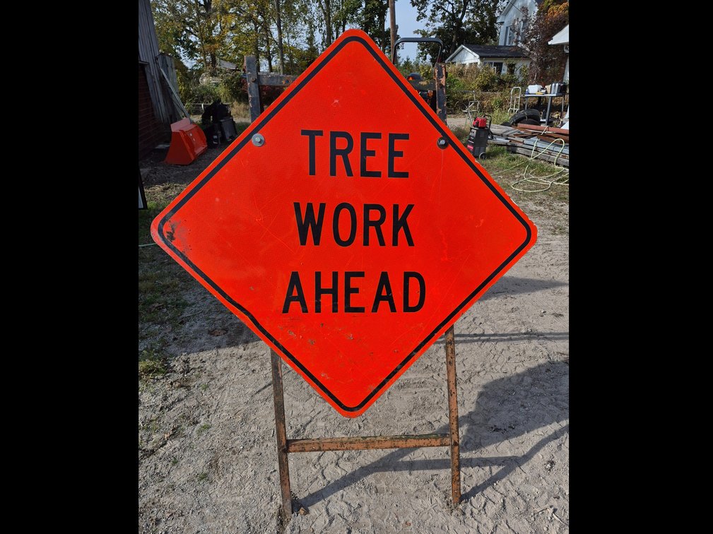 Tree Work Ahead Diamond Road Sign on Metal Stand