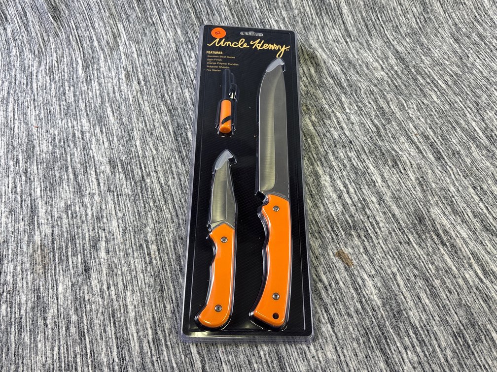 (2) UNCLE HENRY KNIVES W/ SHEATHS & FIRE STARTER