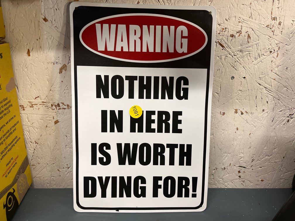 NOTHING WORTH DYING FOR SIGN