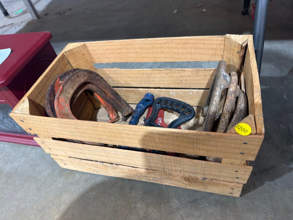 WOODEN CRATE OF HORSESHOES