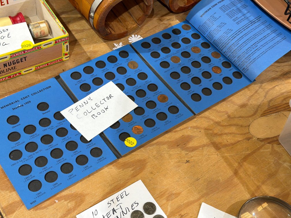 PENNY COLLECTOR BOOK WITH FEW PENNIES