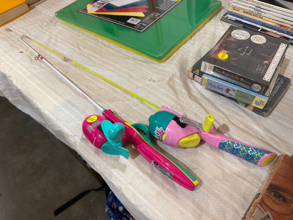 TWO GIRLS FISHING POLES