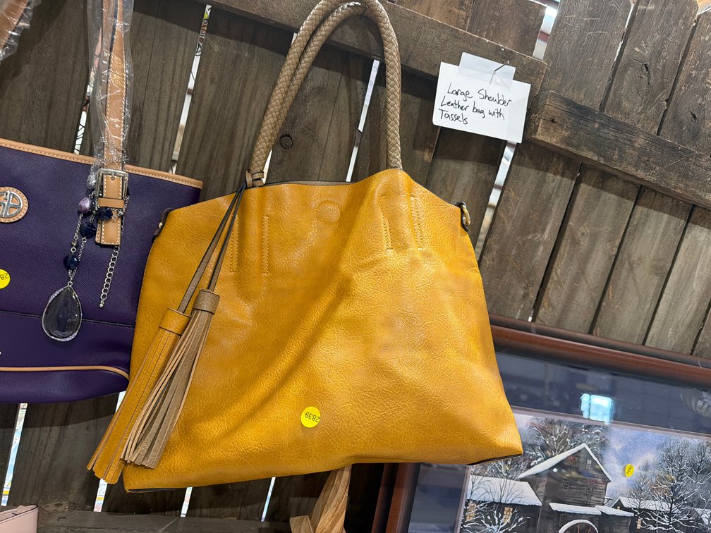 LARGE LEATHER SHOULDER BAG WITH TASSELS