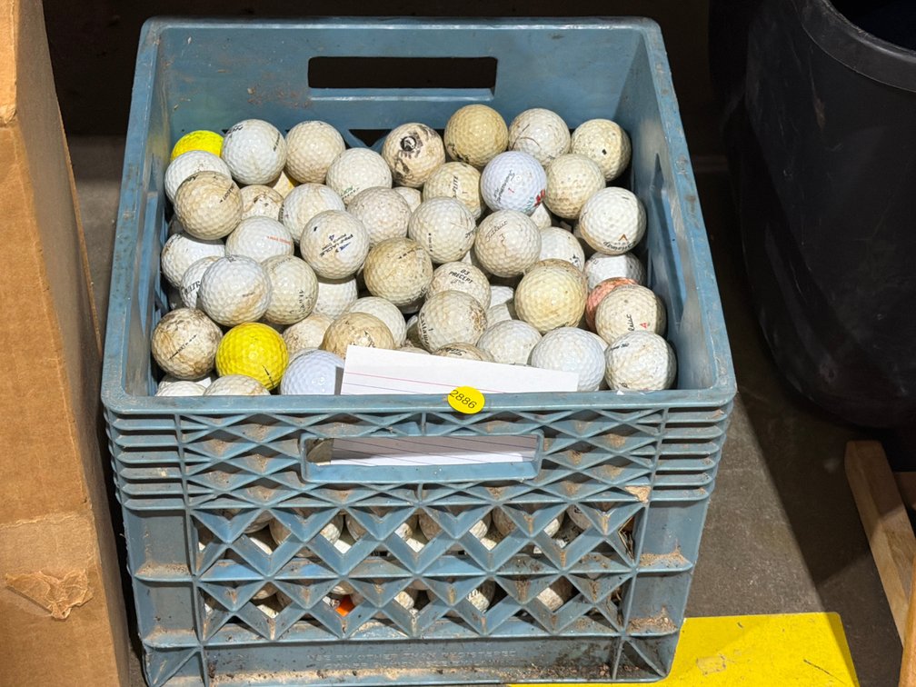 MILK CRATE OF GOLF BALLS