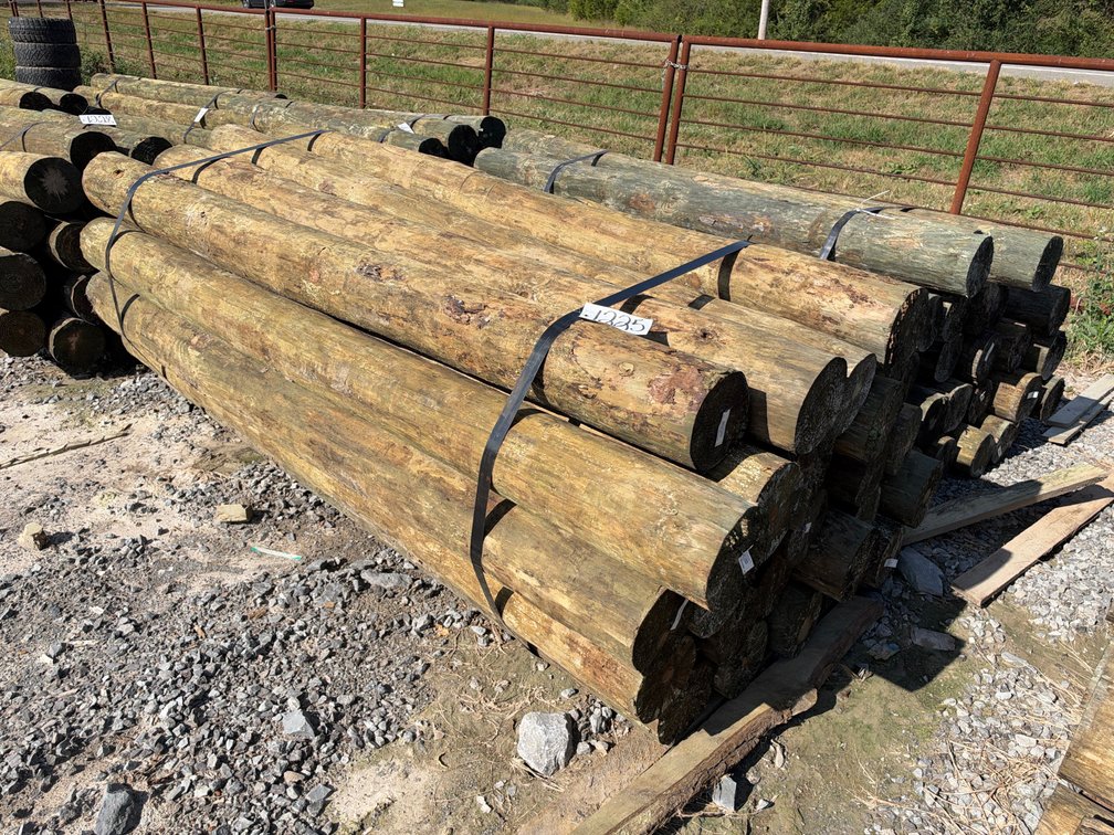 BUNDLE OF (25) 7”-8”X8’ TREATED POSTS