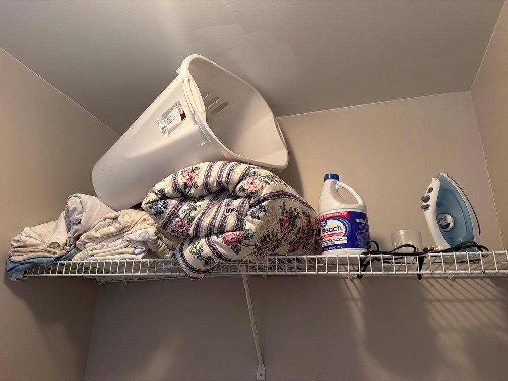 COMFORTER, LAUNDRY BASKET, IRON, AND LINENS