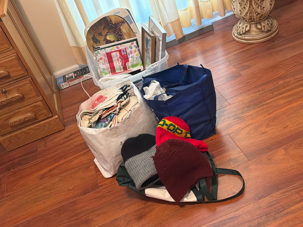 LOT OF DISH TOWELS , FRAMES , ETC
