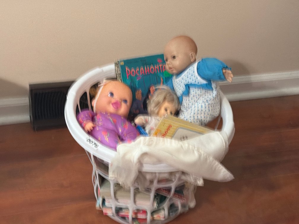 BASKET OF DOLLS AND KIDS BOOKS