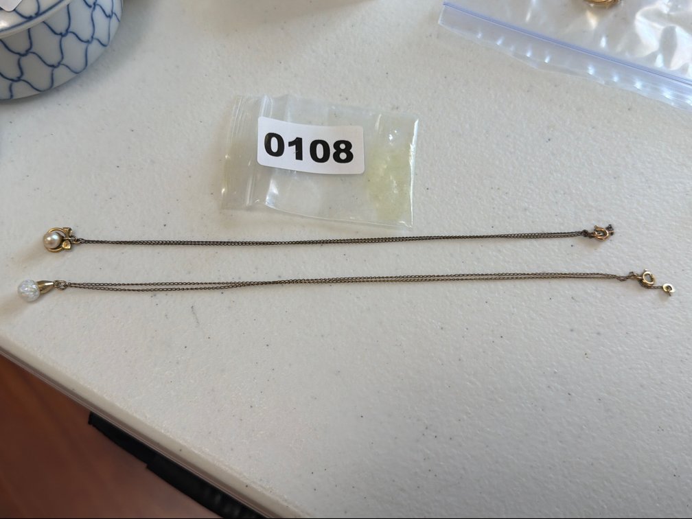 TWO NECKLACES MARKED 10k