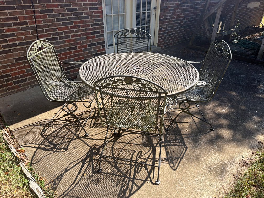 WROUGHT IRON PATIO TABLE AND 4 CHAIRS