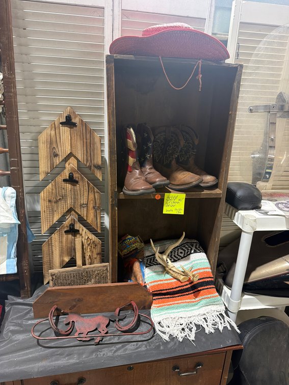 WOOD SHELF WITH WESTERN DECOR AND CHILDRENS BOOTS