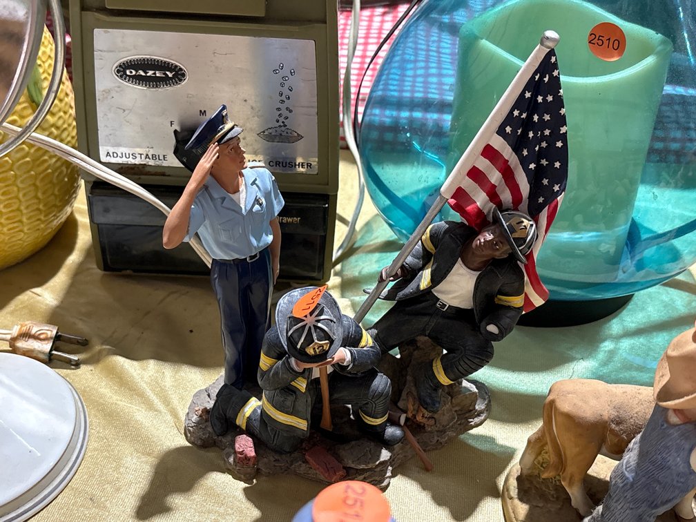 A HEROS SALUTE FIGURINE