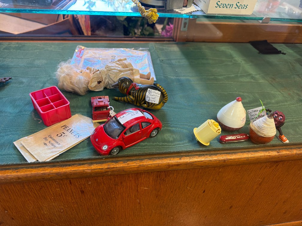 DOLL, TOY VEHICLES, KNIFE, MISC
