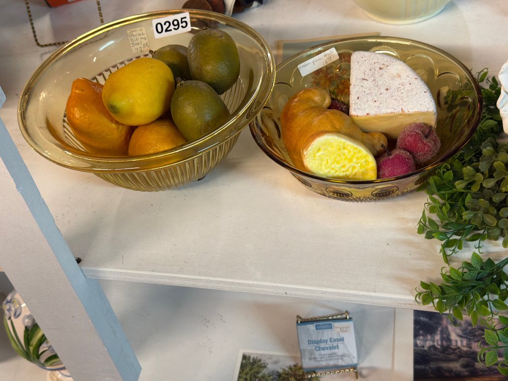 TWO AMBER GLASS MIXING BOWLS AND ARTIFICIAL FRUIT