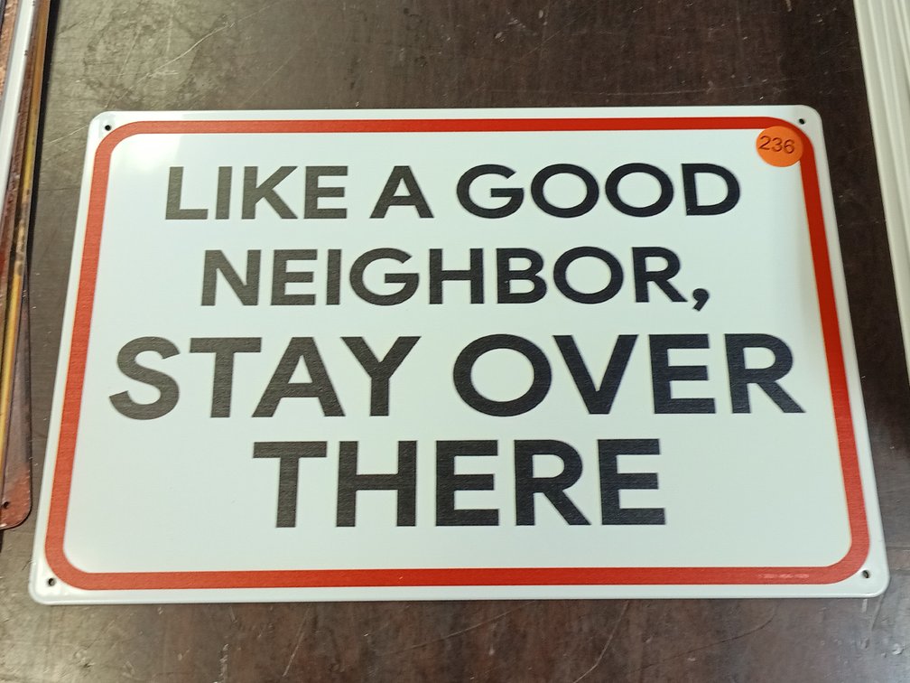 LIKE A GOOD NEIGHBOR SIGN