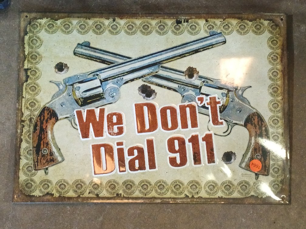 WE DONT DIAL 911 METAL SIGN