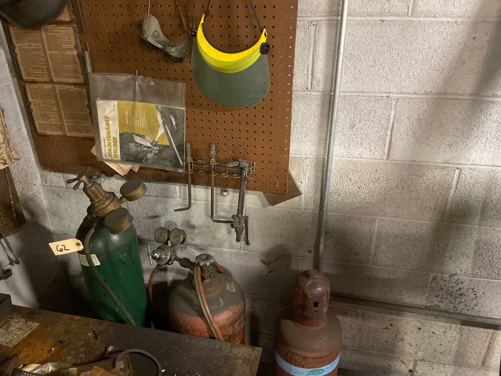 Oxy/Acetylene Burning Outfit Torches & Mask on Wall